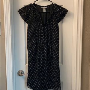 Black with white polka dots knee length dress.
